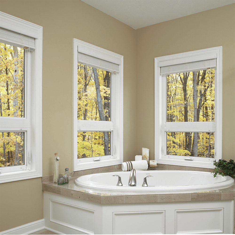 Newly-Installed Replacement Windows in a bathroom with a soaking tub.